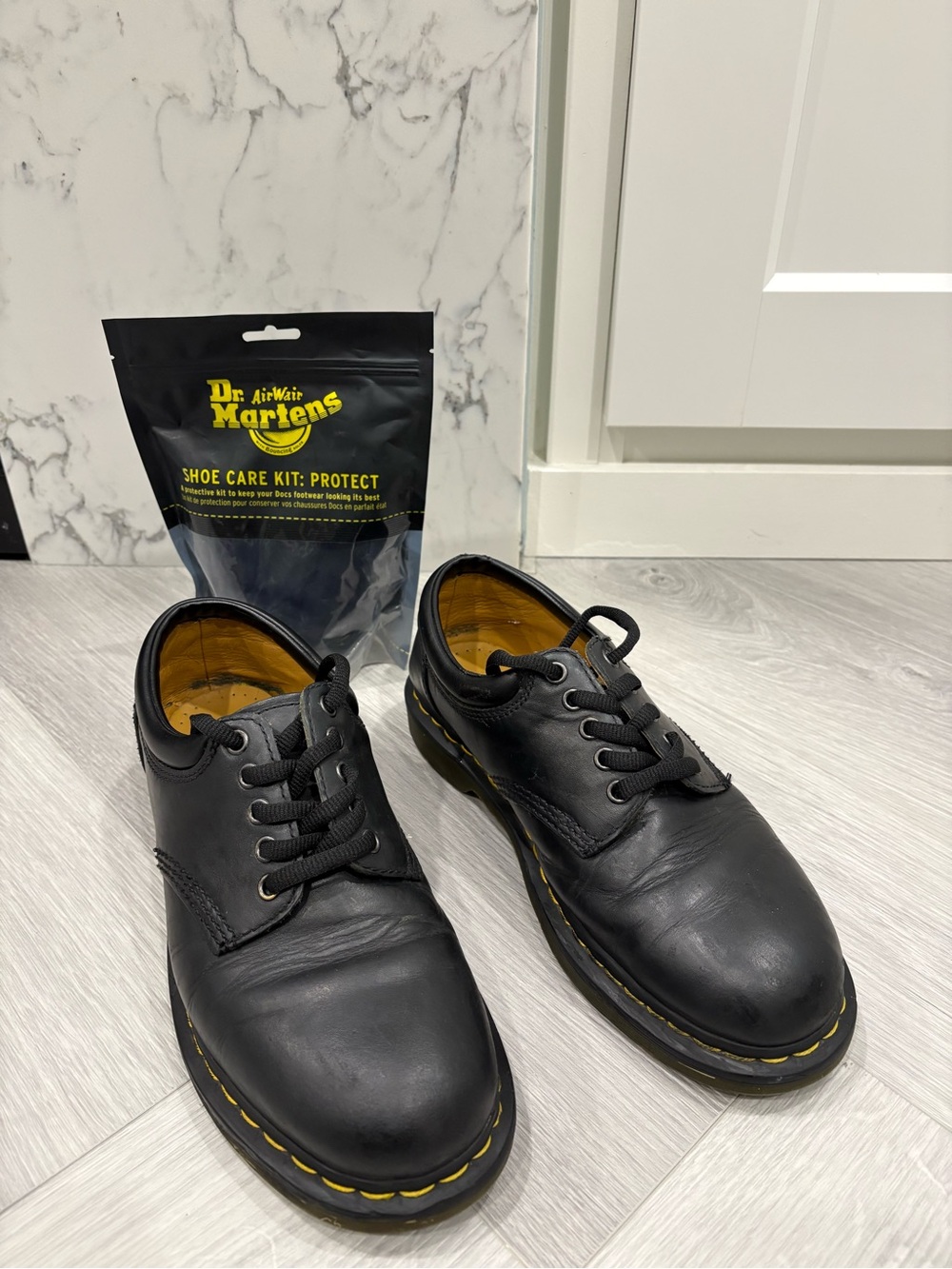 Dr. Martens Men's Black Leather 10-Eye Derby with Yellow Welt Stitching